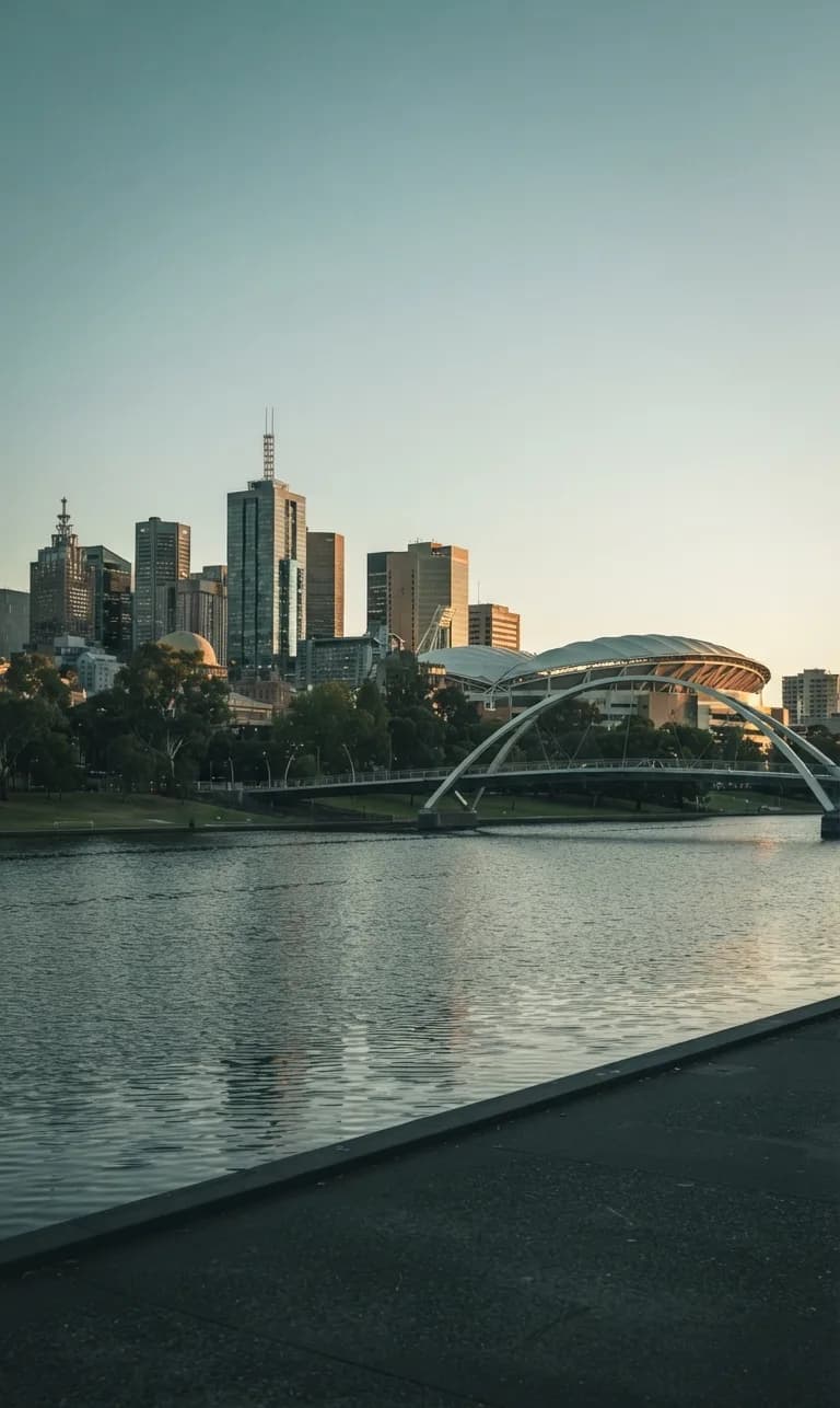 Adelaide's skyline, Adelaide Oval and the riverbank footbridge over the River Torrens at dusk
